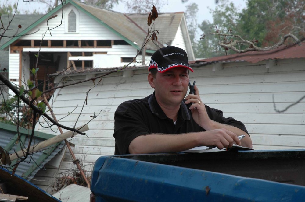 Jeff Wolfe with Doosan providing Hurricane Katrina relief to Biloxi.